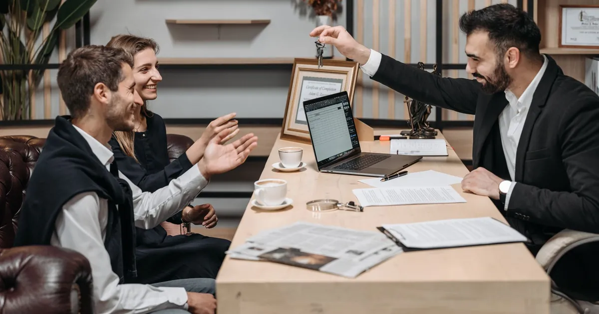 Real estate agent meeting with clients