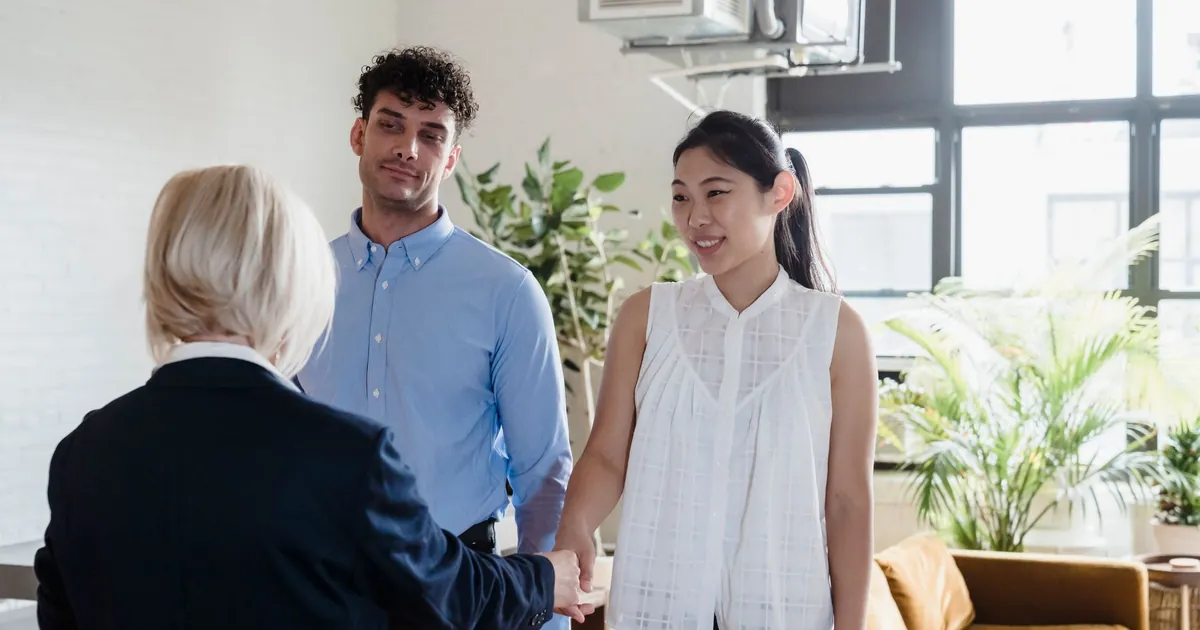 Real estate agent meeting with clients