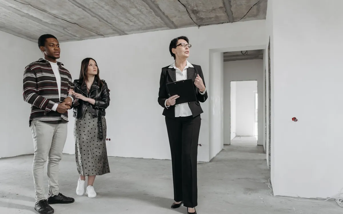 Agent walking buyers through a property