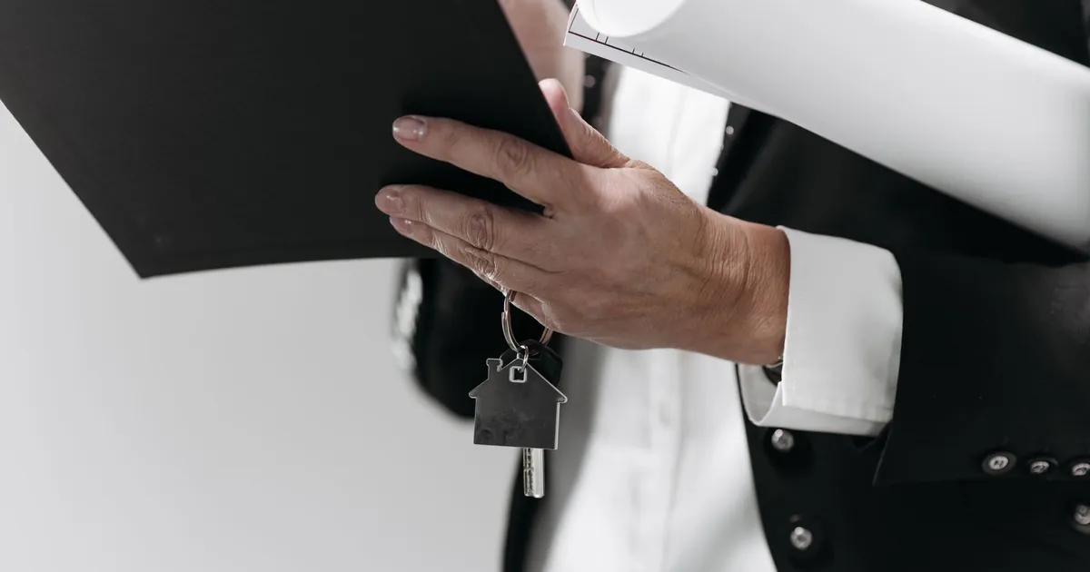 Mortgage loan paperwork and house keys on a desk