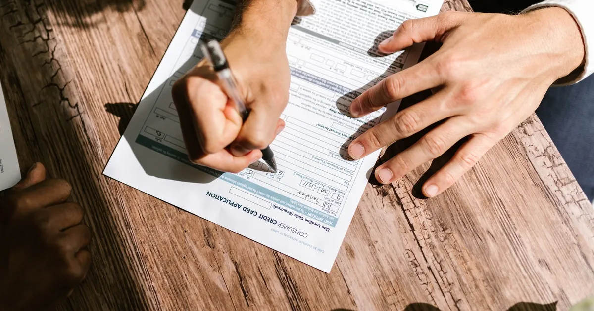 Mortgage loan paperwork and house keys on a desk